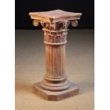 A Terracotta Garden Pedestal in the form of a truncated Cornithian Column.
