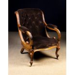 A Victorian Upholstered Mahogany Armchair.