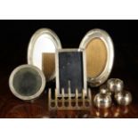 A Collection of Silver: Four photograph frames with Birmingham hallmarked; an oval pair dated 1919,