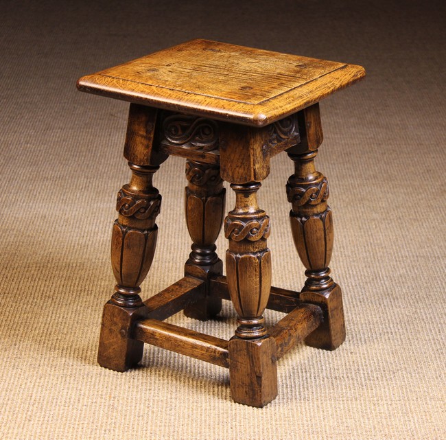A Carved 'Priory' Joined Oak Stool.
