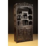 A Fine 19th Century Chinese Hardwood Display Cabinet intricately pierced & carved throughout with