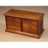 A 19th Century Mahogany Bank of Six Stationary Drawers standing on a moulded plinth base.