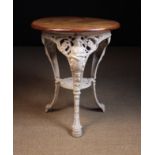A 19th Century Cast Iron 'Brittania' Garden Table painted white.
