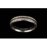 An 18 Carat White Gold Spacer Ring inset with two rows of small cut diamonds.