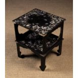 A Small Oriental Two Tiered Black Lacquered Table inlaid with mother-of-pearl flowers,