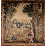 A Late 17th/Early 18th Century Tapestry depicting two young men at leisure: one with bow & arrow