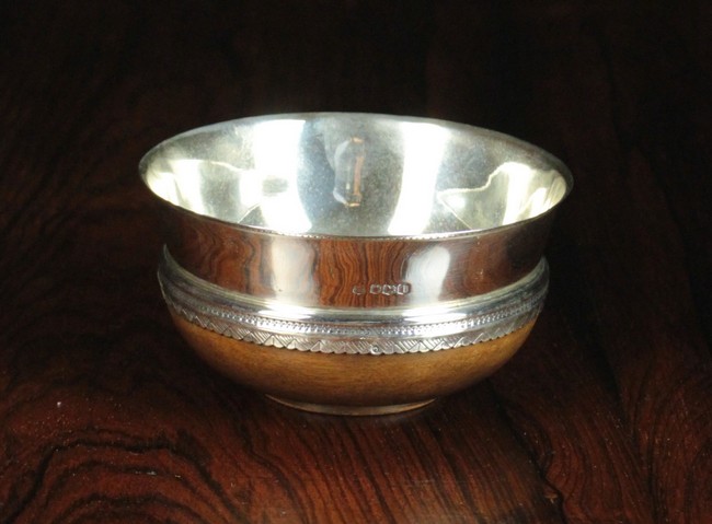 A George V Silver Mazer with turned maple base,