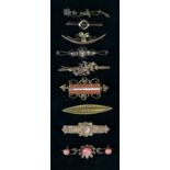 A Collection of Antique Gold Coloured Tie Pins and Bar Brooches inset with chip diamonds and semi