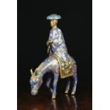 An Antique Cloisonné Figure of a Man on Horseback,