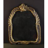 A Carved Oak Cartouche Mirror enhanced with gilding.