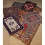 A Collection of Small Rugs (A/F) to include: A red & blue Persian rug with multi banded border
