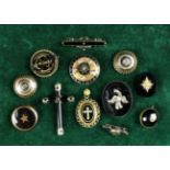 A Collection of Ten Victorian Mourning Brooches, a locket and a pendant crucifix.