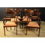 A Set of Eight Regency Mahogany Dining Chairs including two armchairs.