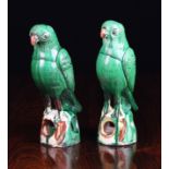 A Pair of 18th Century Chinese Green Glazed Ceramic Parrots, 8¼ ins (21 cms) in height.