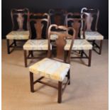 A Set of Six Irish Georgian Walnut Dining Chairs.