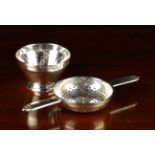 An Art Deco Silver Tea Strainer and dish.