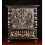 A 19th Century Colonial Ebony Table Cabinet decorated with decorative bone inlay.