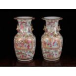 A Pair of 19th Century Cantonese Baluster Vases decorated in polychrome enamels with figural scenes