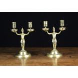 A Pair of Figural Brass Twin Branch Candlesticks.