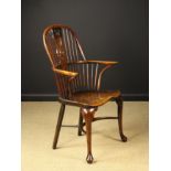 A Yew wood Cabriole-legged Windsor Armchair.