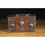 A Small 16th Century Swiss Boarded Wooden Casket bound in decorative sheet iron straps with a lock