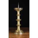 A 16th Century Flemish Bronze Pricket Candlestick with fillet knopped cylindrical stem above a