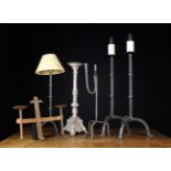 A Wrought Iron Floor Standing Adjustable Candlestand on tripod base 67¼ ins (171 cms) in height.