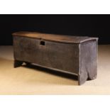 A 16th Century English Riven Oak Chest of boarded construction; possibly a sword chest.