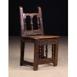 A Fine 17th Century Spanish Chip Carved Walnut Child's Chair of rich colour and patination.