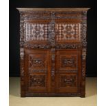 A Fine Mid 17th Century Flemish Oak Cupboard richly carved and adorned with intricate geometric