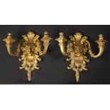 A Pair of Fine Règence Style Carved Giltwood Wall Sconces carved with foliate crested satyr's face