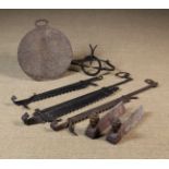 A Collection of Hearth-side Ironware: Three 18th Century wrought iron chimney cranes,