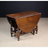 An 18th Century Oak Gateleg Table.