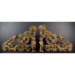 A Pair of 18th Century Ornamental Brackets pierced and carved with voluted strap-work entwined with