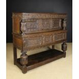 A Fine James I Carved Oak Court Cupboard, possibly of Somerset/Gloucester Origin, Circa 1620.