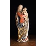 A 16th Century Polychromed Wood Carving of The Virgin and Child.