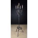 A Wrought Iron Floor Standing Five Branch Candelabra copied from an illustration in Judith & Marton