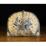 An Arch-topped Cushion covered in 16th/17th Century Italian blue sculpted velvet embroidered with