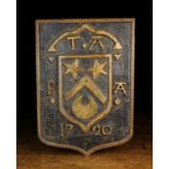 An 18th Century Painted Oak Relief Carved Plaque with armorial shield and possible marriage