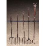 A Good Collection of Five 18th Century Steel Toasting Forks ranging in length from 17½ in (45 cm)