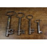 Four Various 17th Century Iron Keys, ranging from 5¼ in (13 cm) to 2½ in (6.5 cm) in length.
