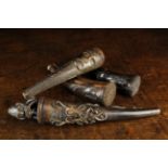 Three Indonesian North Sumatran Toba Batak Bullet Retainers enriched with face mask carving,