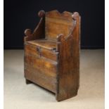 A Small 17th Century Bench composed of dark patinated pine planks decorated with run moulding.