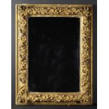 A Rectangular Wall Mirror in a 19th Century Gilt Gesso-work Frame ornamented with undulating