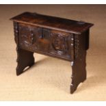 A Small & Rare Carved Oak Child's Coffer of boarded construction.