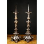 A Pair of Carved Baroque Candlesticks.