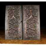 A Pair of Gothic Oak Panels carved with elaborate tracery decoration incorporating quatrefoil