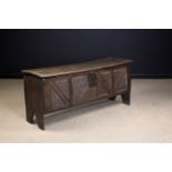 A Late 16th/Early 17th Century Boarded Oak Coffer with geometric chip carving,