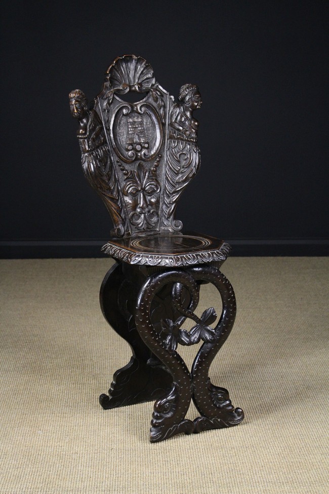 A 19th Century Carved Sgabello-type Hall Chair.