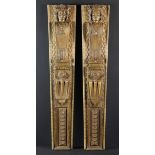 A Pair of 16th Century Figural Pilasters carved with angel head caryatids and adorned with split